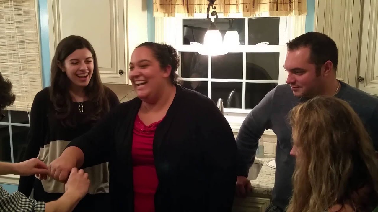 An audience laughing and reacting to Kevin the Magician's performance